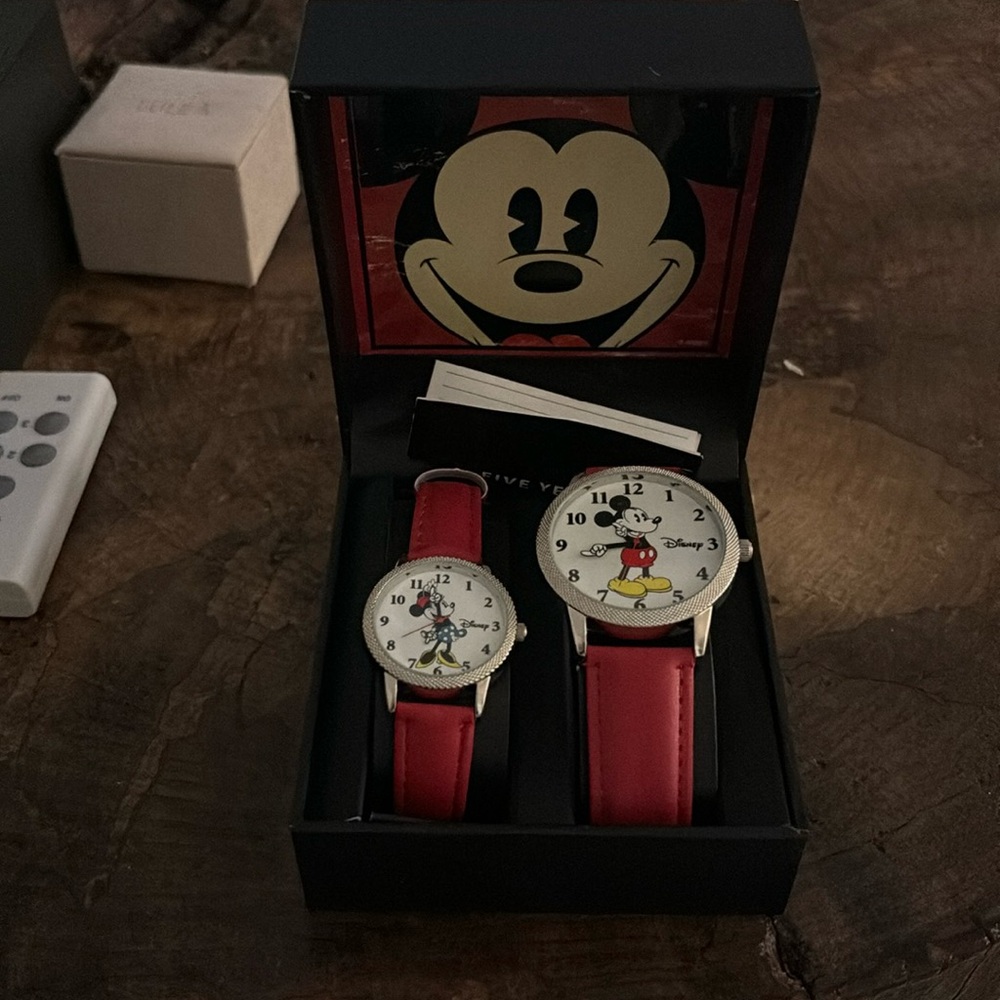 Brand new his and her Disney watches.